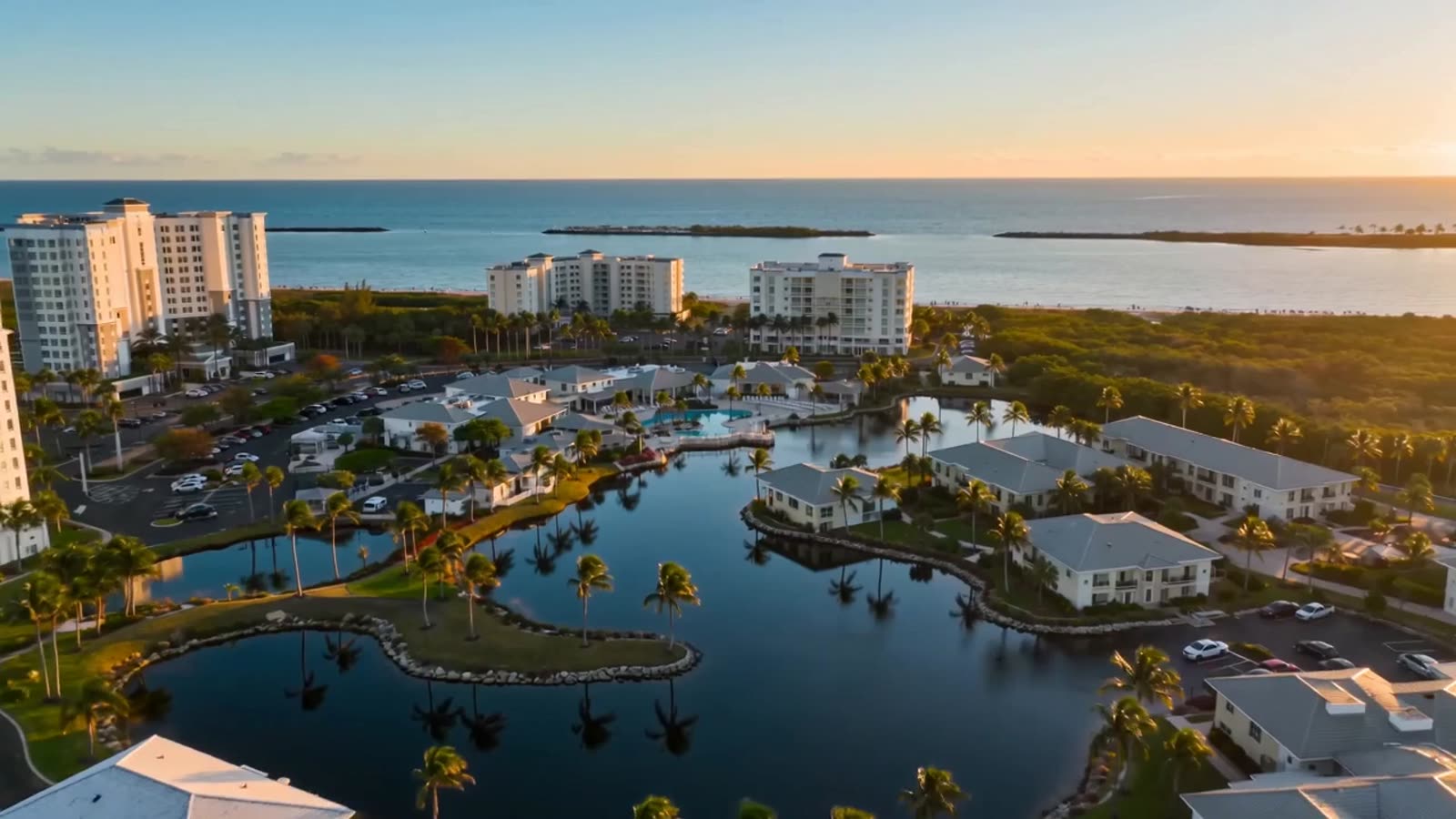Aerial view of a Gulf-front Southwest Florida community at golden hour